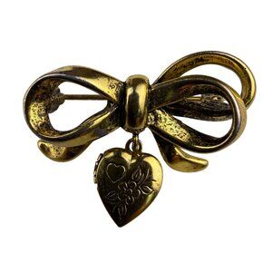 Antique Gold Tone Metal Bow Brooch With Heart-Shaped Floral Design Locket